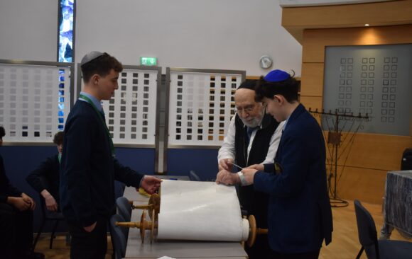 Students Help Repair Torah Scroll